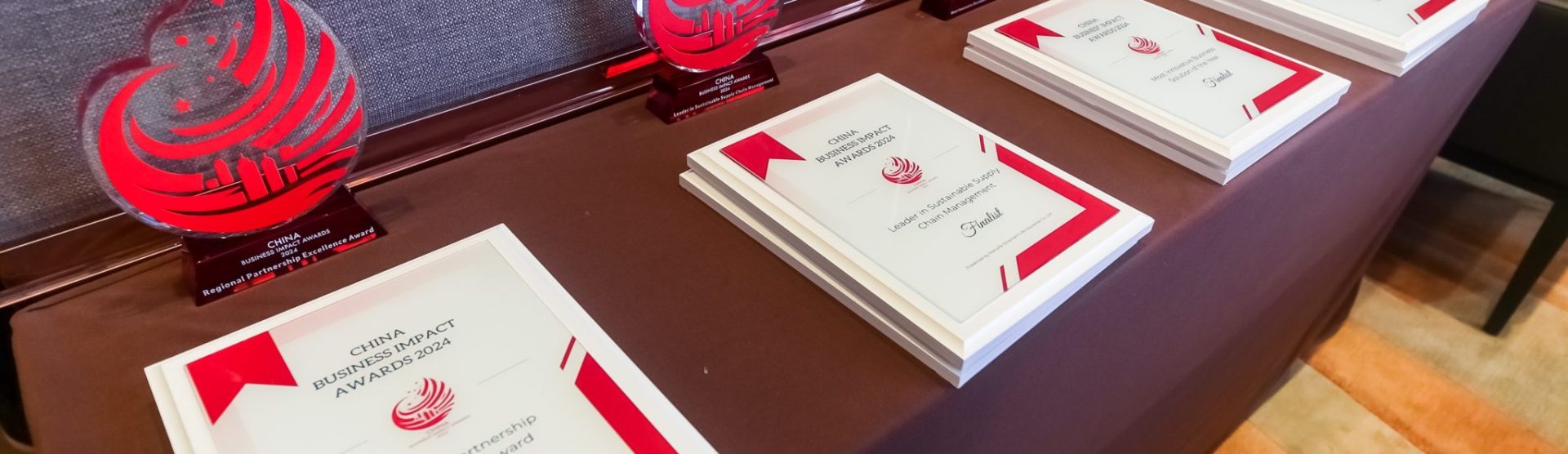 Business Impact Awards trophies and finalist plaques